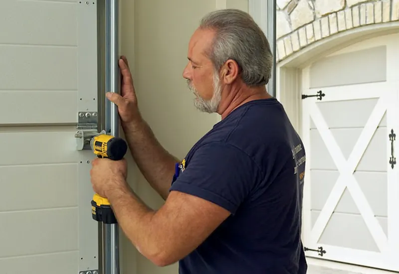 Installer adjusting a garage door track